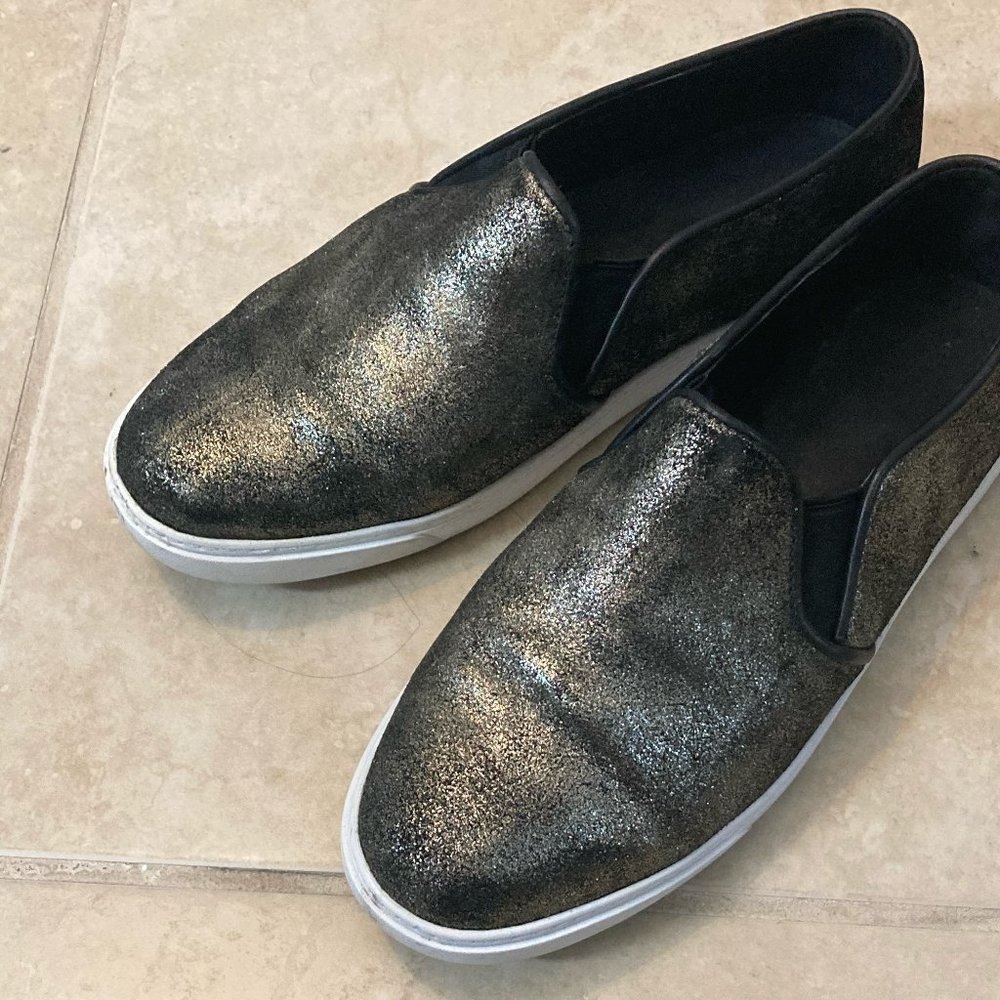 Cole Haan Black and Gold Slip ons